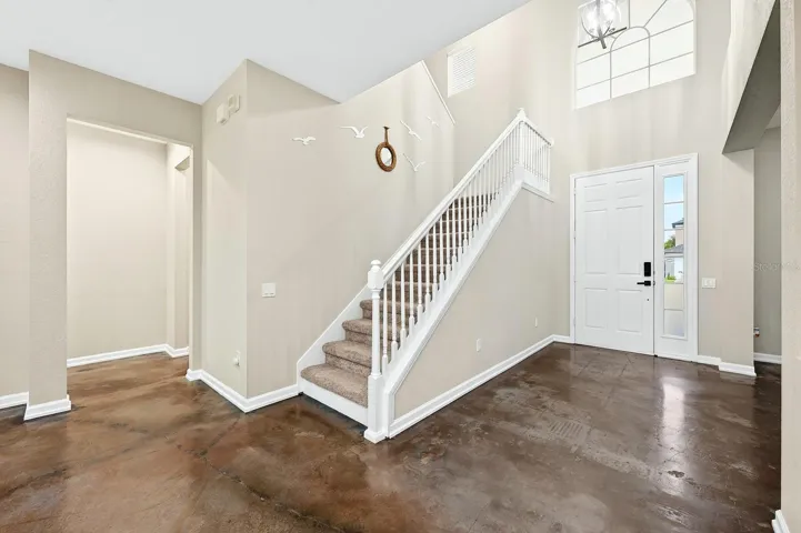 The light filled two story foyer welcomes you home!