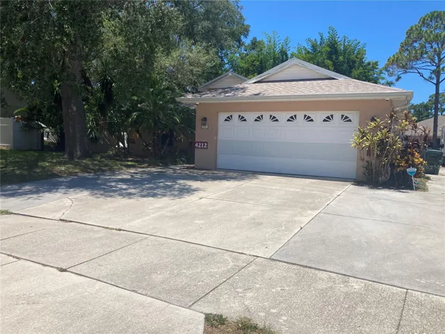 Front of Home with 2 Car Garage and lots of parking off street