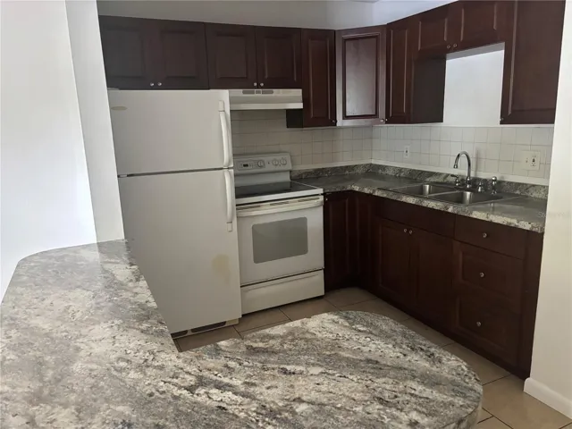 Nice spacious kitchen. Island also includes storage cabinets.