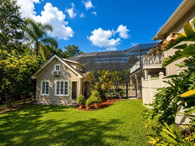A detached playhouse offers its own air conditioning, a cozy loft &amp; a screened back porch.