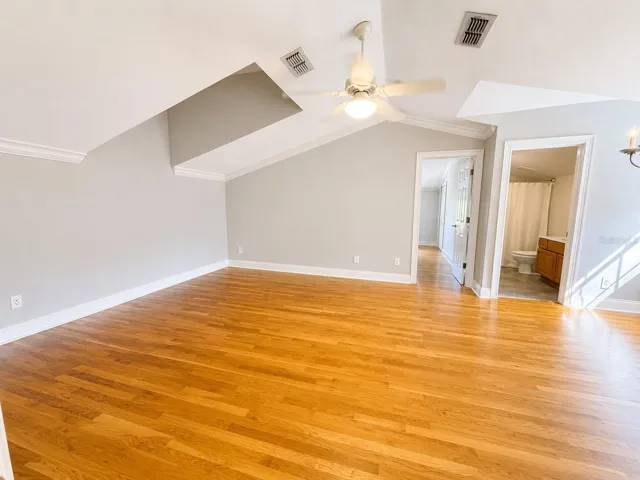 A fully renovated 1 bedroom apartment above the garage offers its own private covered entrance &amp; full kitchen, w/ new luxury vinyl flooring, quartz counters &amp; stainless steel appliances. The living room &amp; bedroom feature hardwood flooring &amp; crown molding. The entry closet has been upgraded w/ a water hookup for a washer &amp; dryer (not included), a new water heater &amp; the apartment has its own central vacuum.