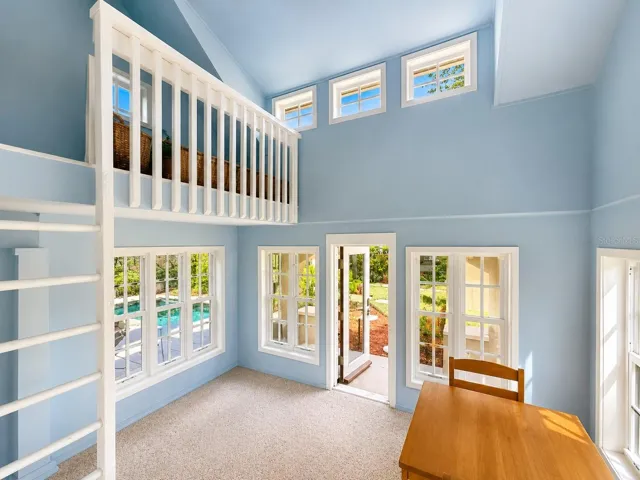 A detached playhouse offers its own air conditioning, a cozy loft &amp; a screened back porch.