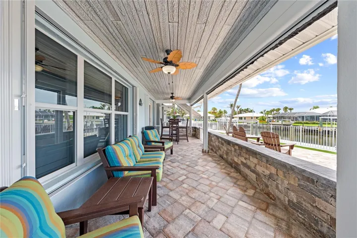 Screened lanai with remote screens - tongue and groove ceiling and ceiling fans