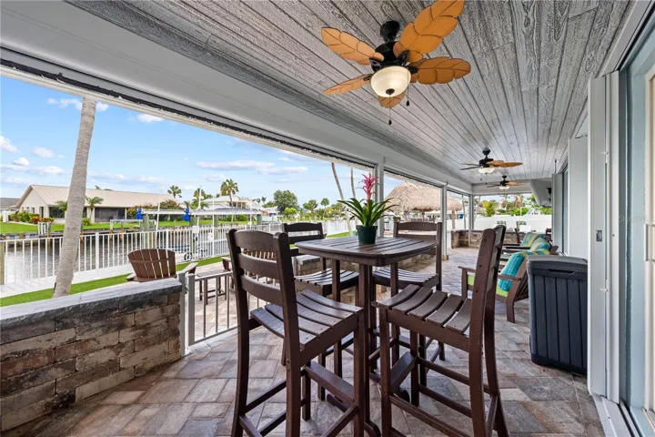 Screened lanai with remote screens - tongue and groove ceiling and ceiling fans