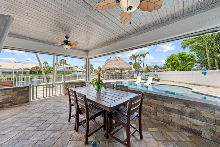 Screened lanai with remote screens - tongue and groove ceiling and ceiling fans