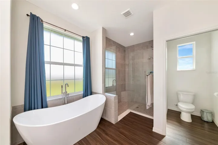 Huge primary bathroom with soaker tub and walk in shower