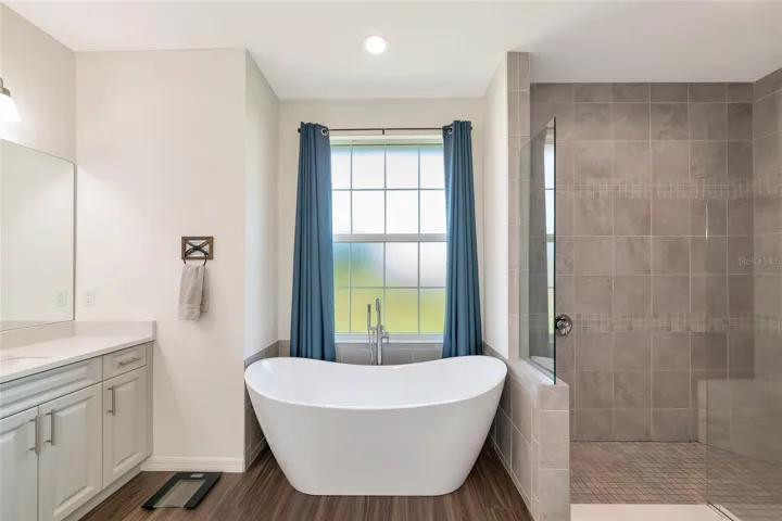 Huge primary bathroom with soaker tub and walk in shower