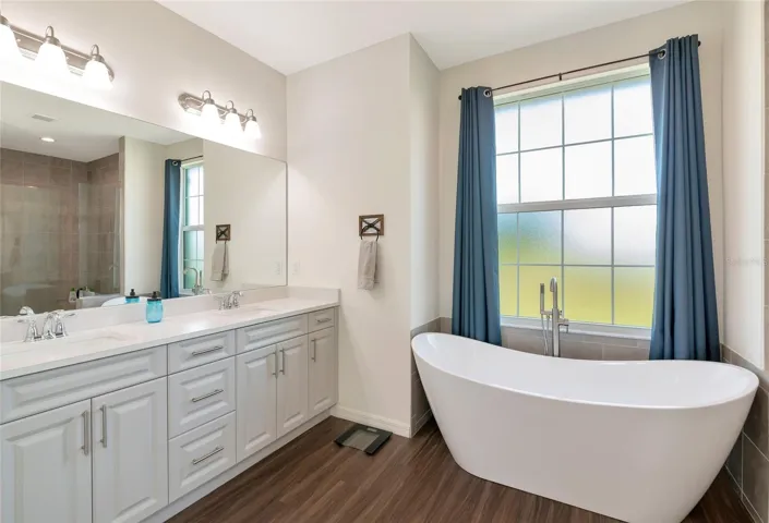 Huge primary bathroom with soaker tub and walk in shower