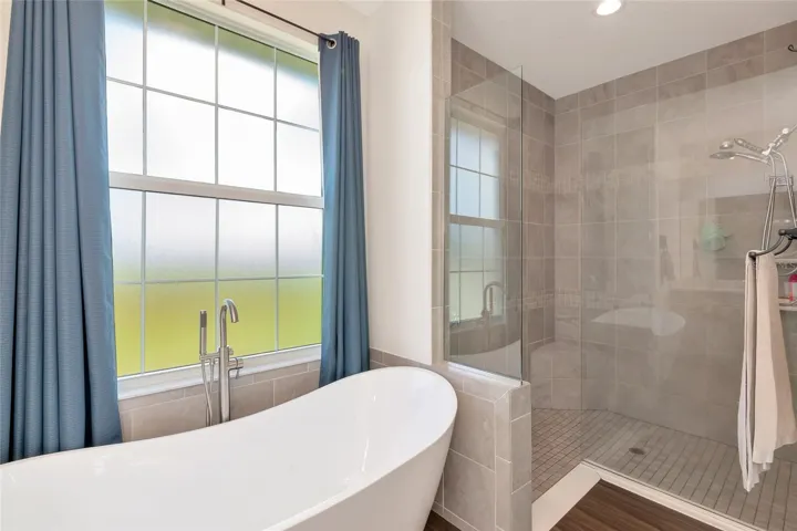 Huge primary bathroom with soaker tub and walk in shower