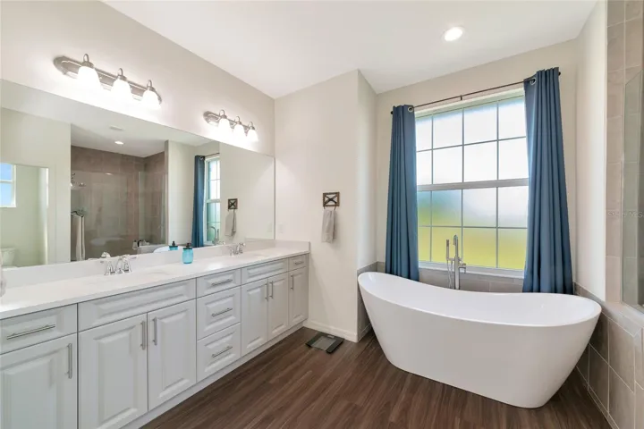 Huge primary bathroom with soaker tub and walk in shower