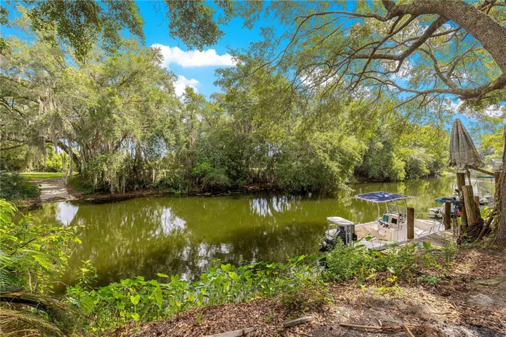 Canal area, fire pit, and dock area.  Room for two or more boats, canoes can rest near boat ramp.