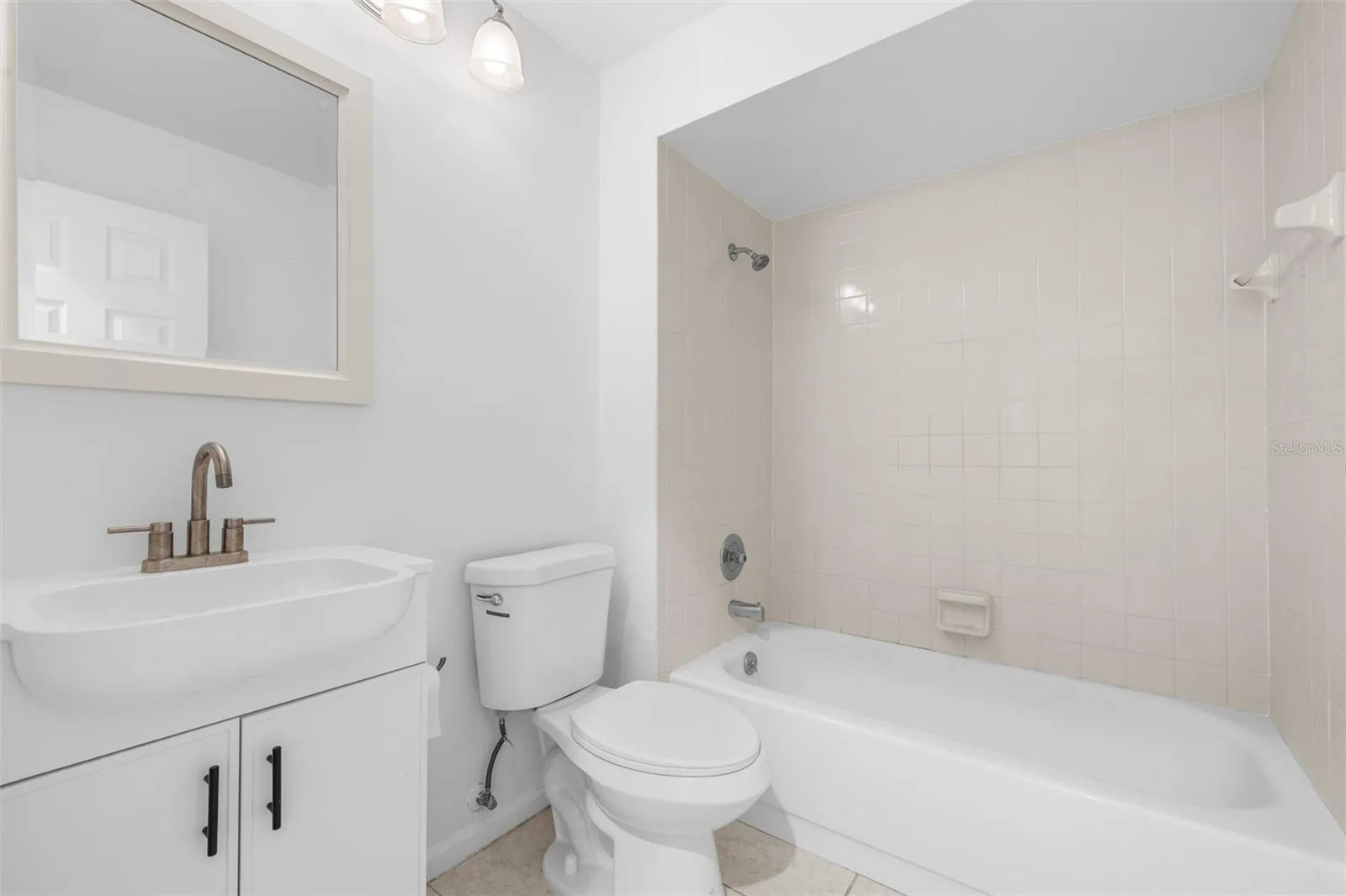 secondary bath with tub and shower combo