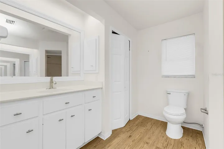 Primary bathroom, shower only, dual vanities and linen closet.
