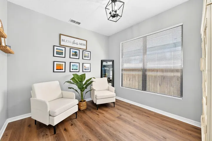 Versatile formal living at the front of the home.