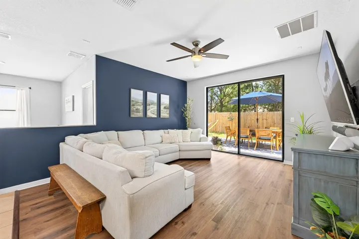 Family room has sliding glass doors that let the natural light pour in.
