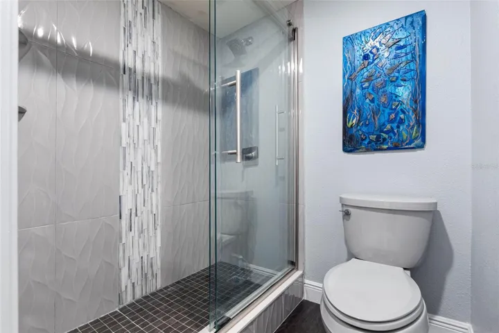 Full Bath on Main Level  Between Kitchen Area and 2nd Guest Bedroom. All 3 Bathrooms Have Been Remodeled.