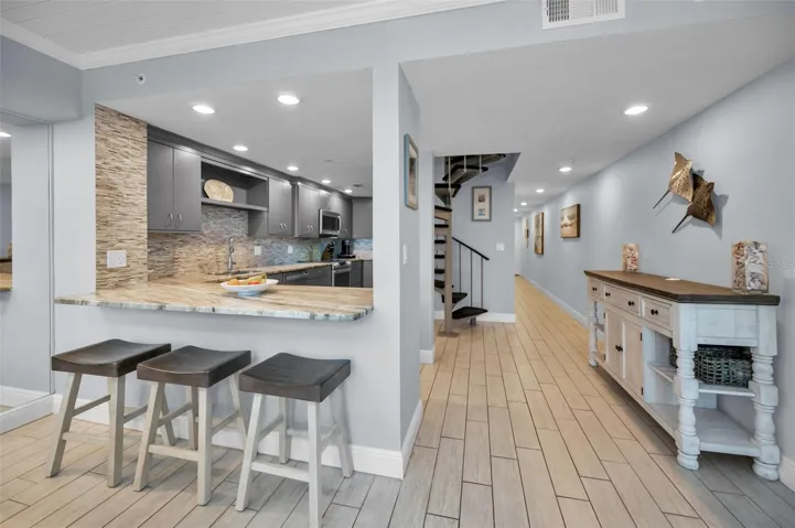 ...Remodeled Kitchen - Good Open Design For Entertaining and Enjoying the Florida Beach Front Lifestyle.