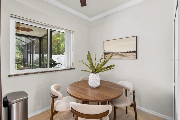 Spacious eat-in kitchen featuring a dedicated breakfast nook, perfect for casual dining and family gatherings.