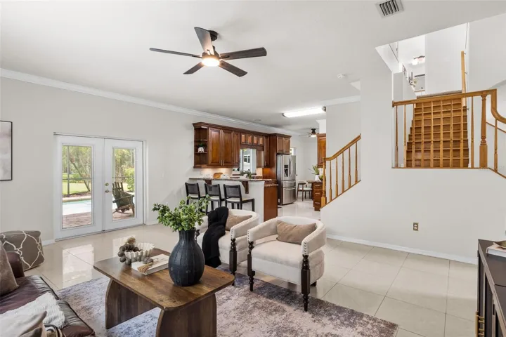 Open floor plan with family room and grand staircase