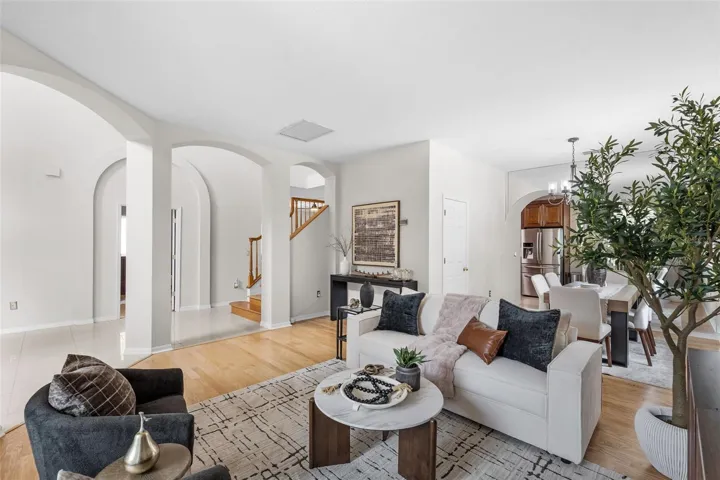 Formal living room with abundant natural light, and spacious layout perfect for hosting guests.