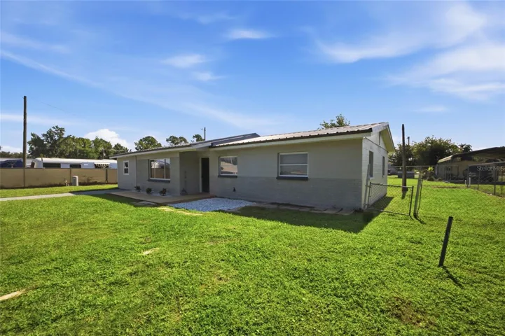 Block home with metal roof. partially fenced.  Wouldn't take much for new homeowner to finish fencing