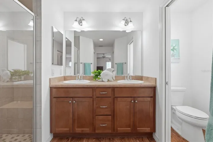 Double Sinks, Tile Shower and Water Closet