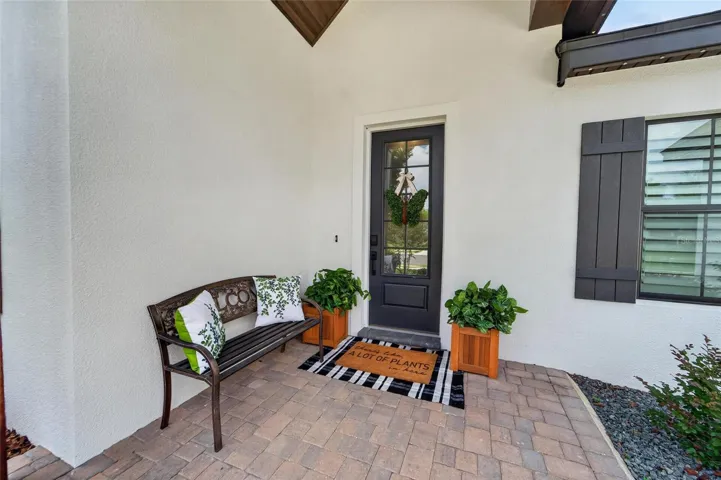 A welcoming front porch nook with pavers