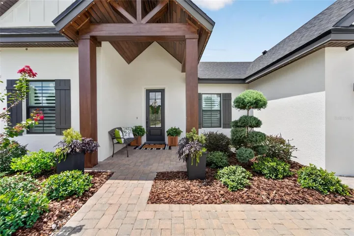 A dramatic timber-beam portico welcomes you home