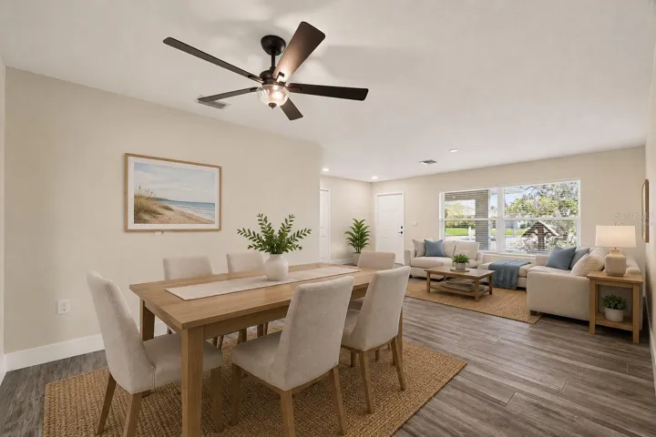 Virtually staged dining room and living room.