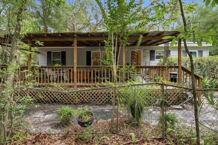 Framed by a canopy of mature trees and lush landscaping, this Homosassa retreat offers a peaceful escape while remaining close to everyday conveniences