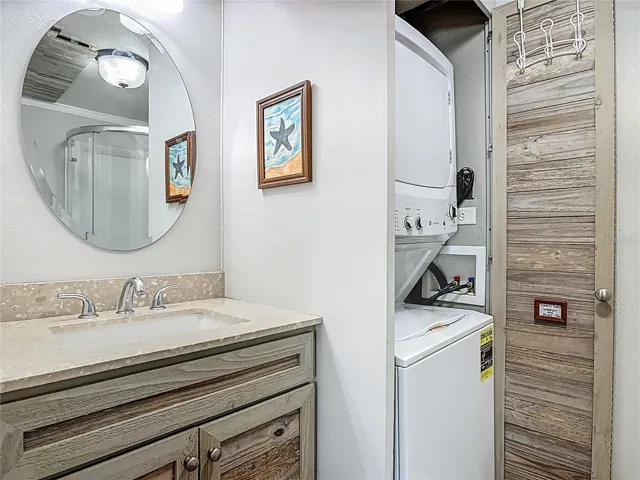en suite bathroom and laundry connected to primary bedroom