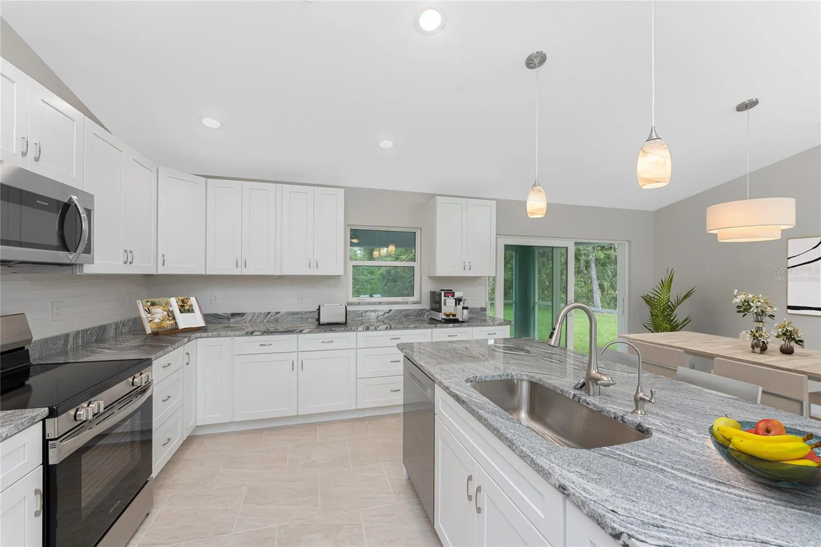 Virtually staged. In this home, the kitchen is on the right side