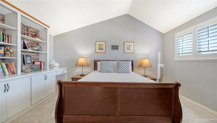 4th bedroom with built-ins and lots of light.