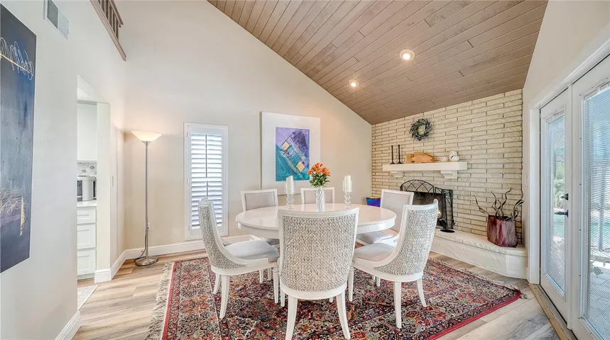 Large dining room with wood burning fireplace.