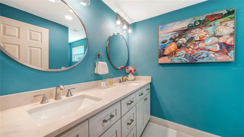 Upstairs bathroom with 2 sinks.