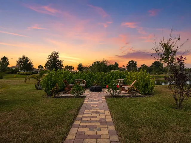Fire pit and outdoor sitting space overlooking the pond