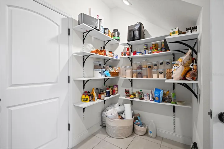 Custom built storage shelves in laundry room