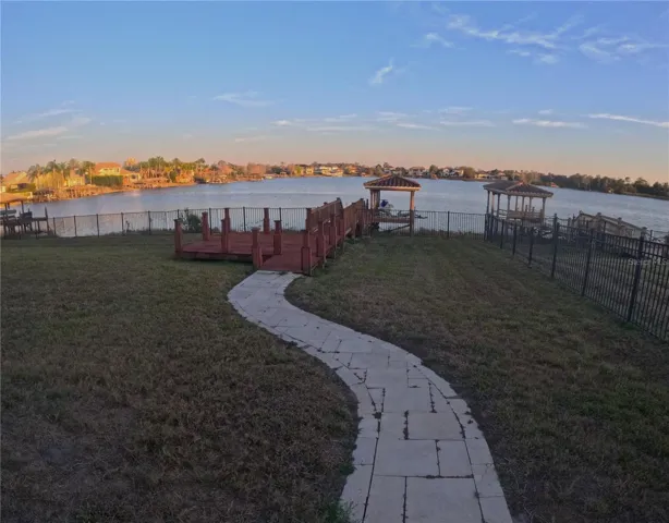 View of rear dock & lake-frontage at sunset