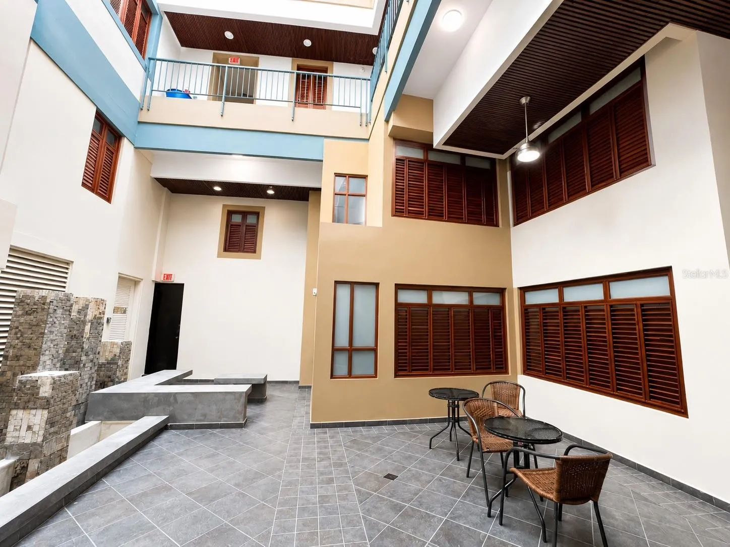 Interior courtyard with seating area and beautifully restored historic architecture.