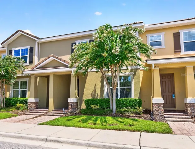 Enjoy the best of Windermere living in this beautifully maintained 4-bedroom, 2.5-bath townhome with a rear facing 2-car garage in the sought-after Lake Burden South community!