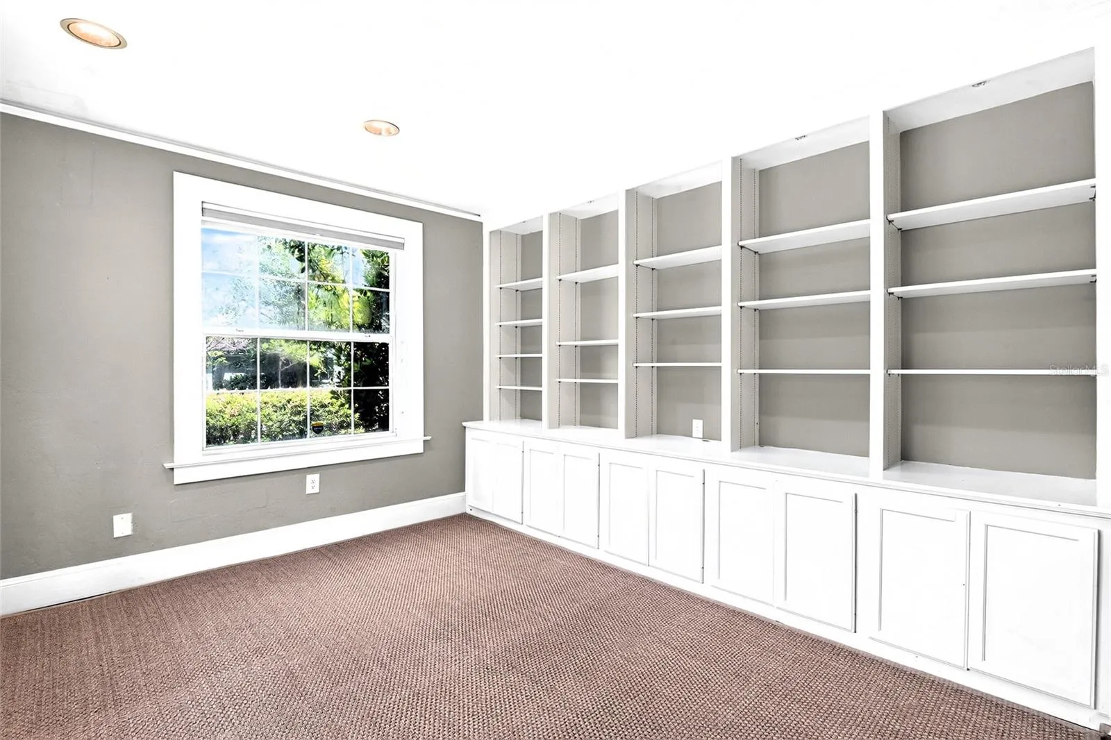 Large Den Has Hand-some Built-in Shelves
