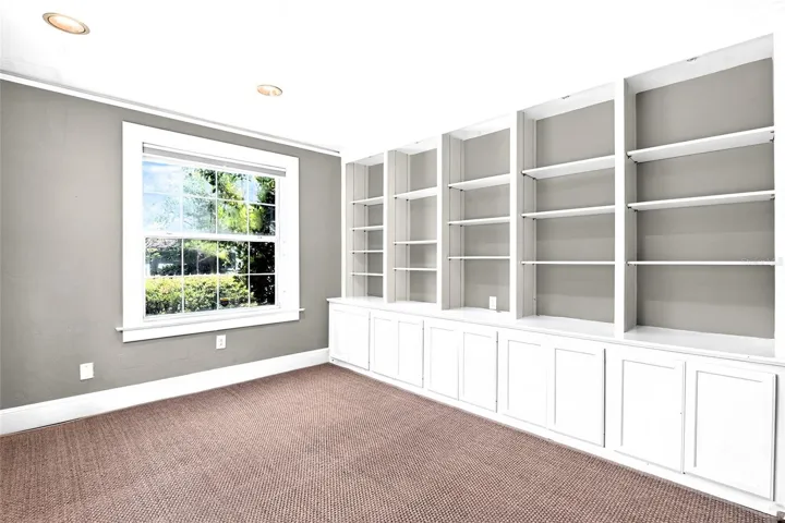 Large Den Has Hand-some Built-in Shelves