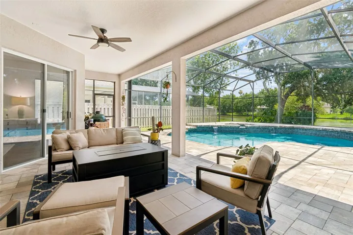 Huge covered lanai is the perfect spot to relax and enjoy the waterviews from the pool and pond