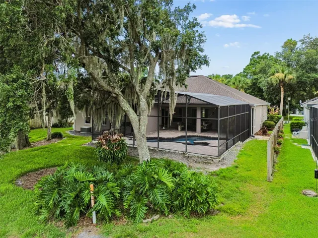 Partially fenced backyard provides some privacy to enjoy your pool