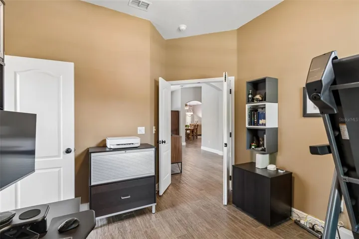 Office/nursery or 5th bedroom with closet just off the foyer with access to primary bathroom