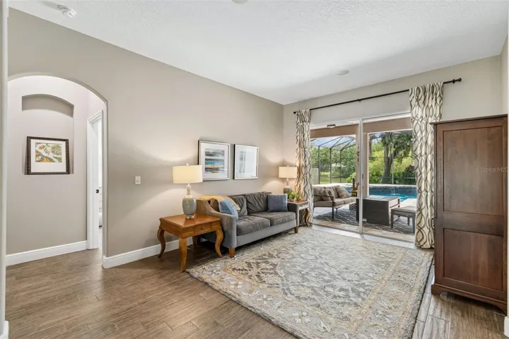 Comfortable and casual living room with stunning pool and pondviews