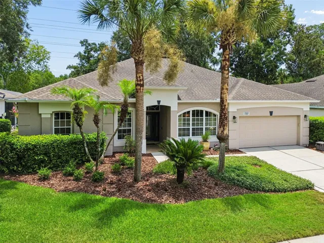 Landscaped low maintenance homesite features St. Augustine lawn and irrigation system with sprinkler meter and reclaimed water.