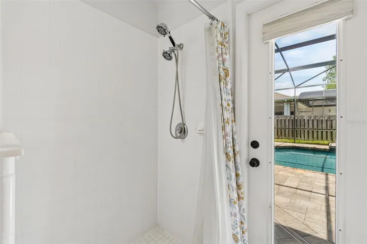 Tiled walk-in shower in 3rd bathroom for quick rinse after swimming