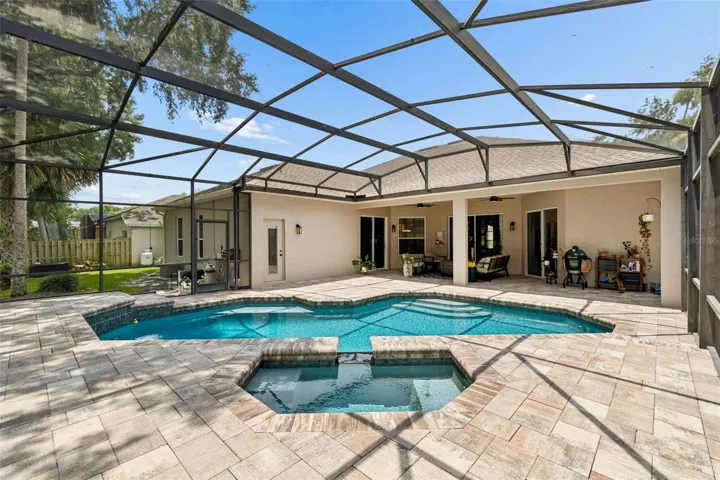 Pool area was refinished in 2021 with new quartz surface, waterline tiles, pool/spa lighting, spillways, deck drains, Hayward propane heater, brick paver deck and coping.