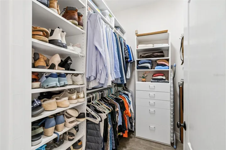 Walk-in primary closet 1